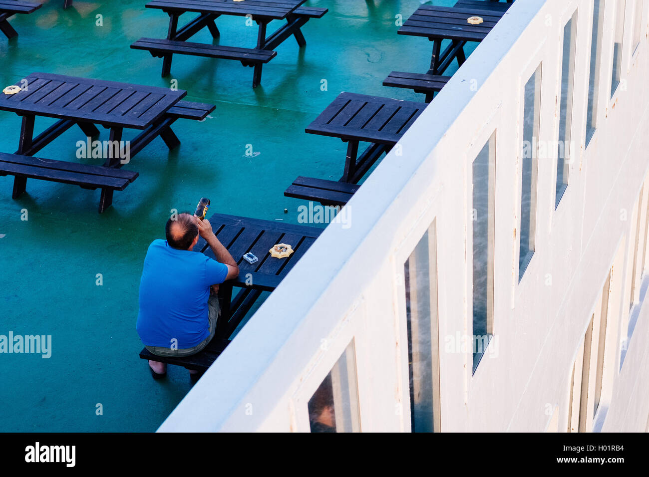 A polish worker drinking beer on a ferry from Poland Gdansk to Stockholm Sweden Stock Photo