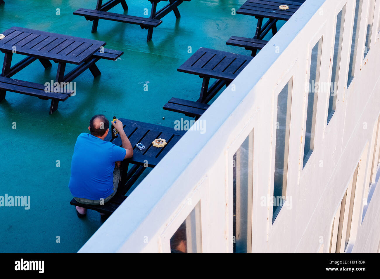 A polish worker drinking beer on a ferry from Poland Gdansk to Stockholm Sweden Stock Photo