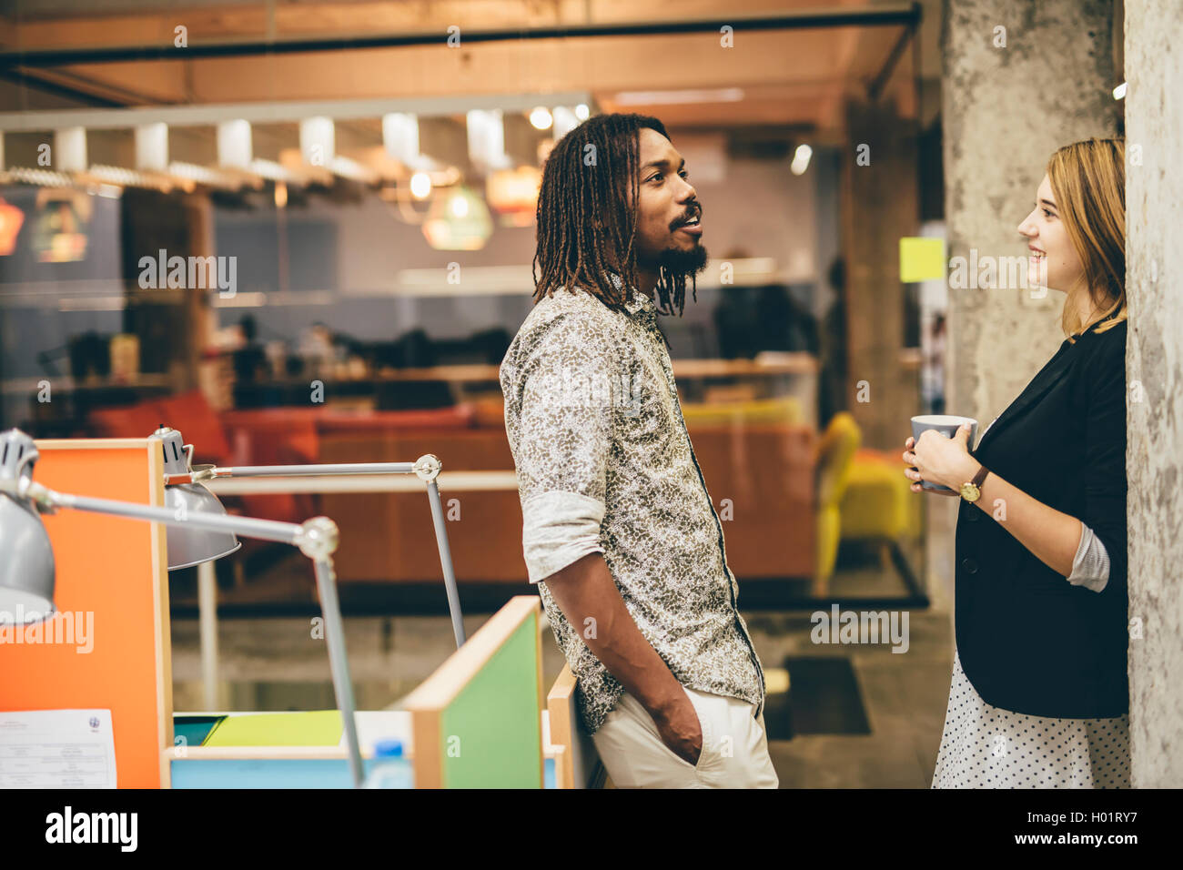 Business colleagues talking in the office Stock Photo - Alamy