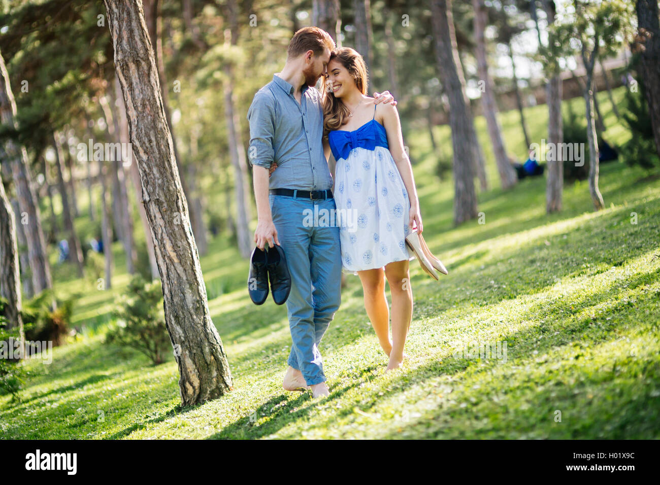 Woman walking barefoot park hi-res stock photography and images - Alamy