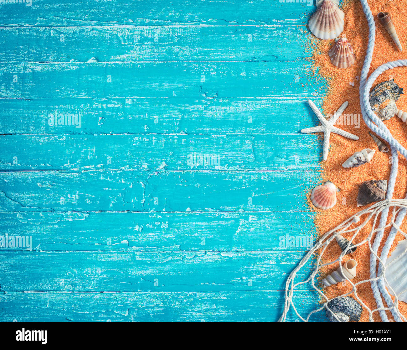 Various sea items from right border of blue wood background Stock Photo ...