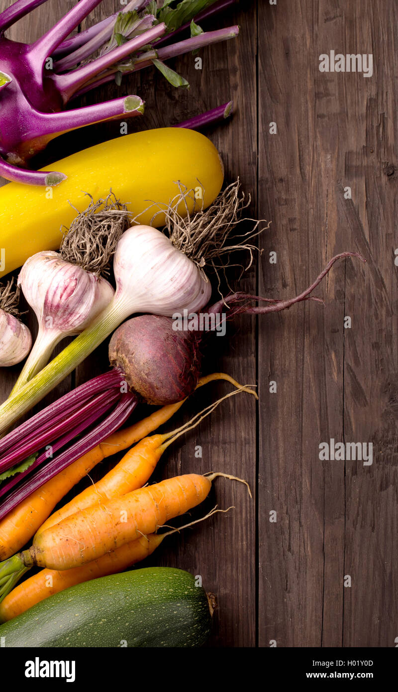 Various vegetables on dark wooden background Stock Photo