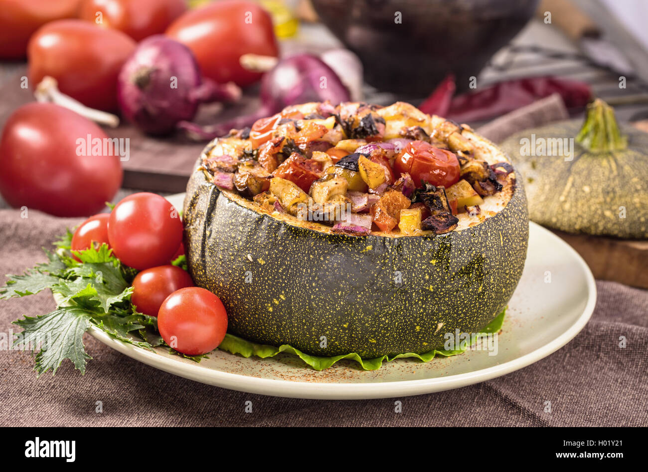 Veggie baked round zucchini on plate Stock Photo