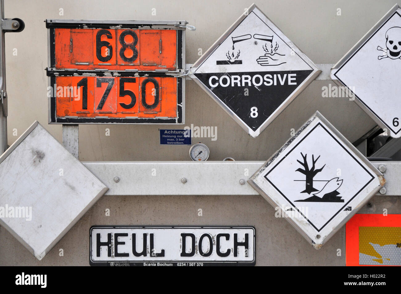 tanker truck with hazard warning panel and sign 'cry me a river!', Germany, North Rhine-Westphalia Stock Photo
