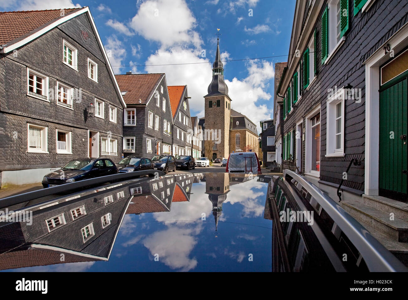 historic old city with St. Paul's Church mirroring on car top, Germany, North Rhine-Westphalia, Bergisches Land, Hueckeswagen Stock Photo
