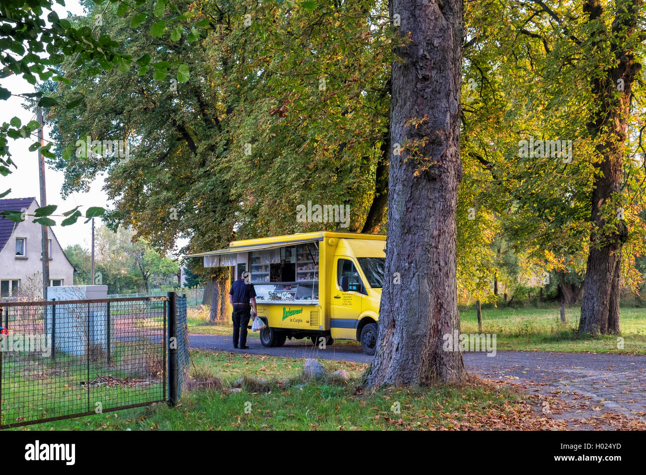 Mobil shop delivers goods to rural customers, Cobbled road Brandenburg, Germany Stock Photo