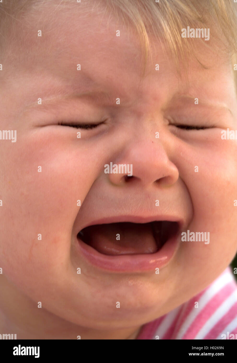 weeping baby, portrait, Austria Stock Photo