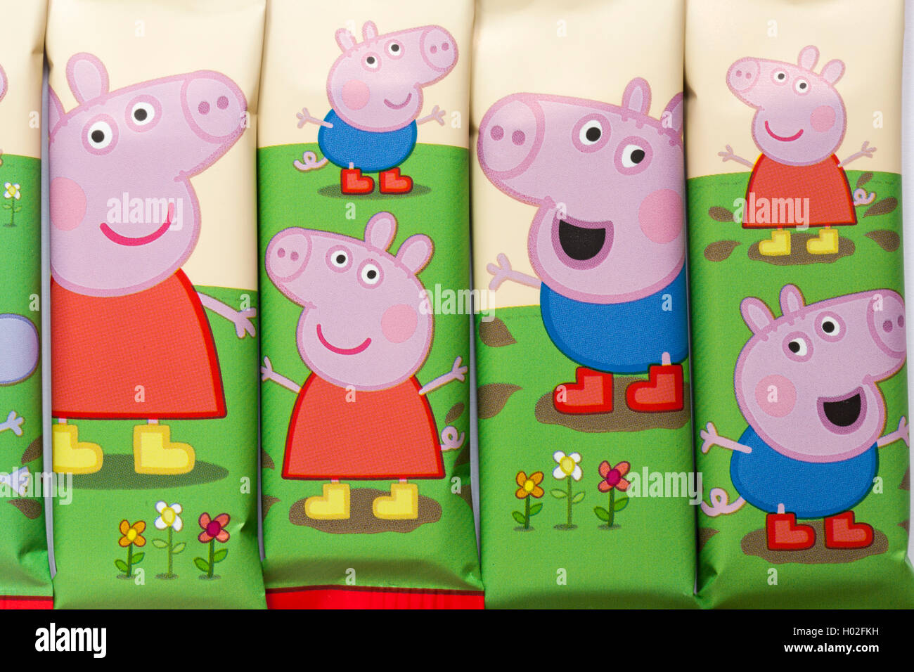 Peppa Pig muddy puddle bars from Kinnerton - white chocolate bars with a muddy puddle splat made in Great Britain Stock Photo