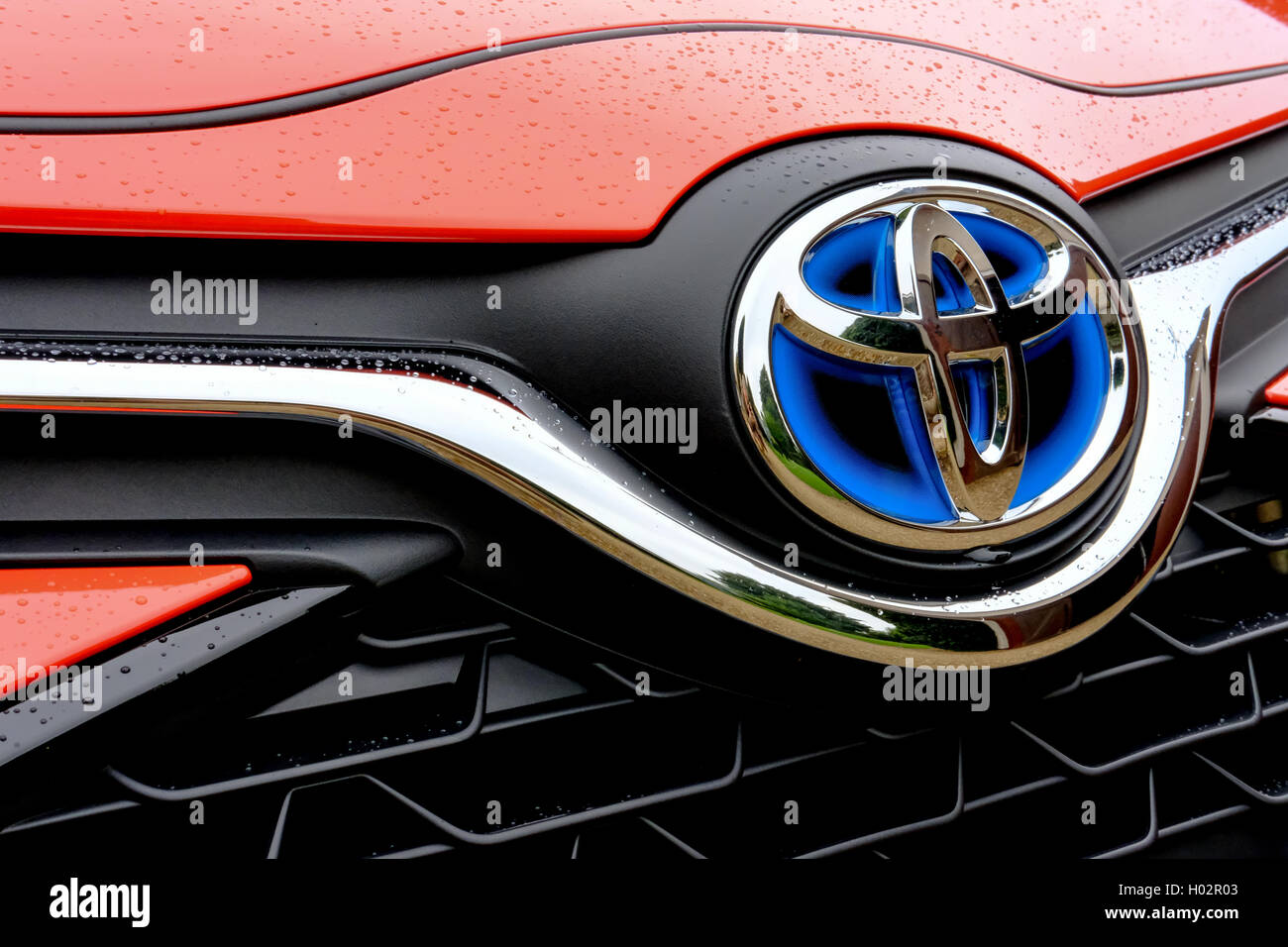 Front bonnet and grille section of a new, limited edition Toyota Yaris  Hybrid Orange Edition 2016 motor vehicle Stock Photo - Alamy