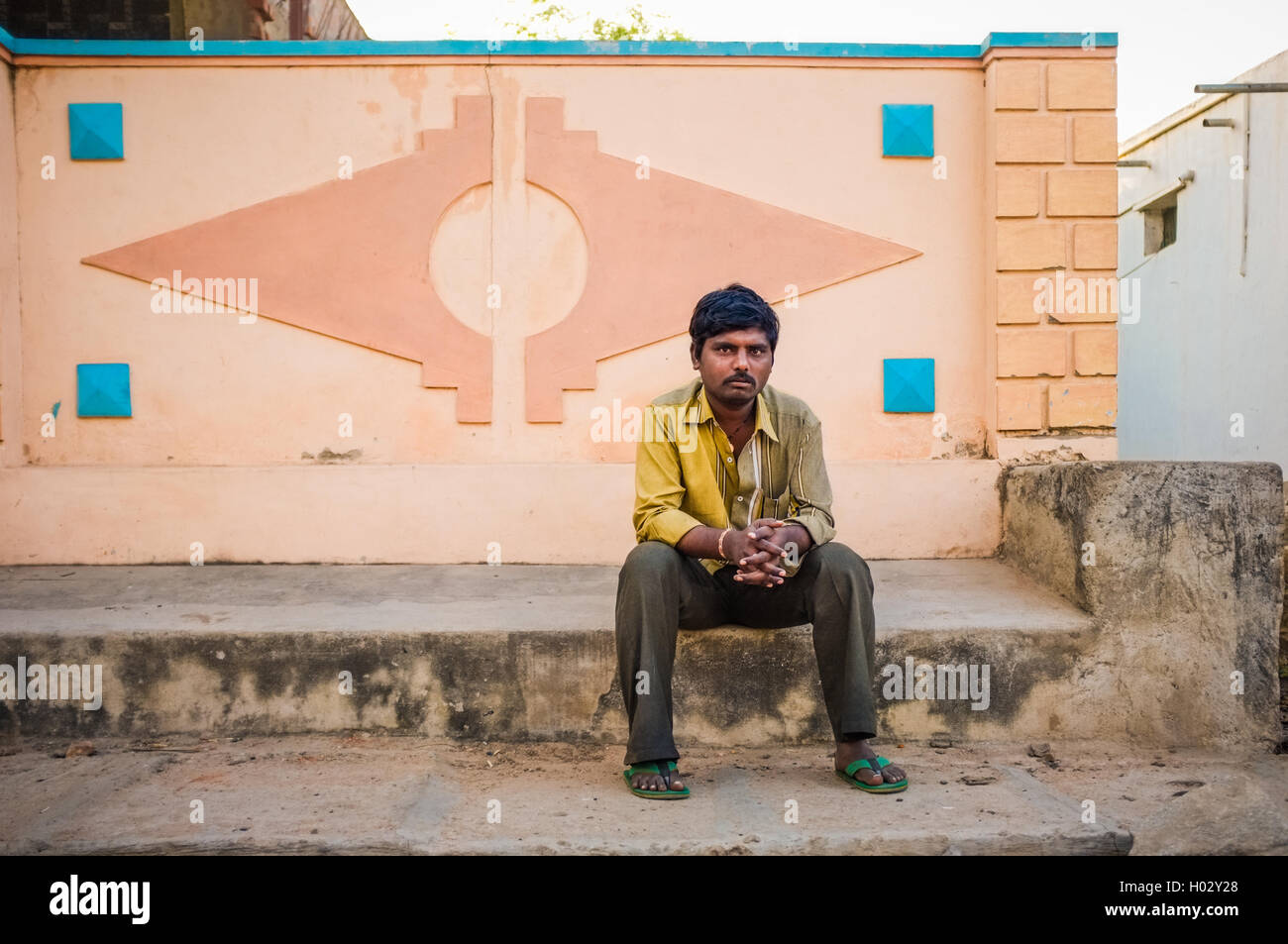KAMALAPURAM, INDIA - 02 FEBRUARY 2015: Single indian man sitting in ...