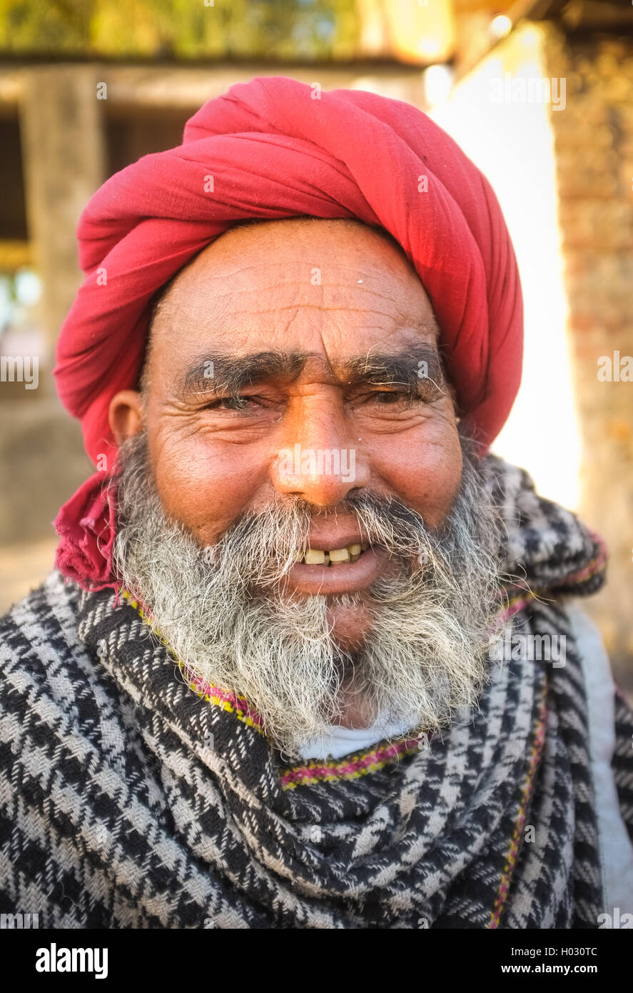 GODWAR REGION, INDIA - 14 FEBRUARY 2015: Elderly Rabari tribesman with red turban and blanket around the shoulders. Rabari or Re Stock Photo