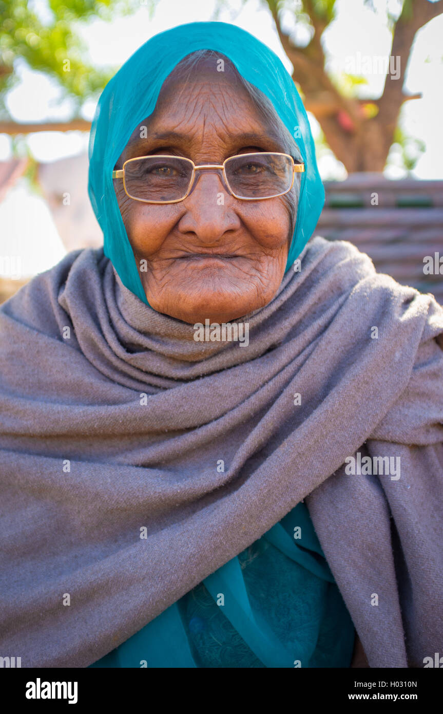 GODWAR REGION, INDIA - 14 FEBRUARY 2015: Elderly Indian woman in glasses with headscarf and blanket around shoulders. Stock Photo