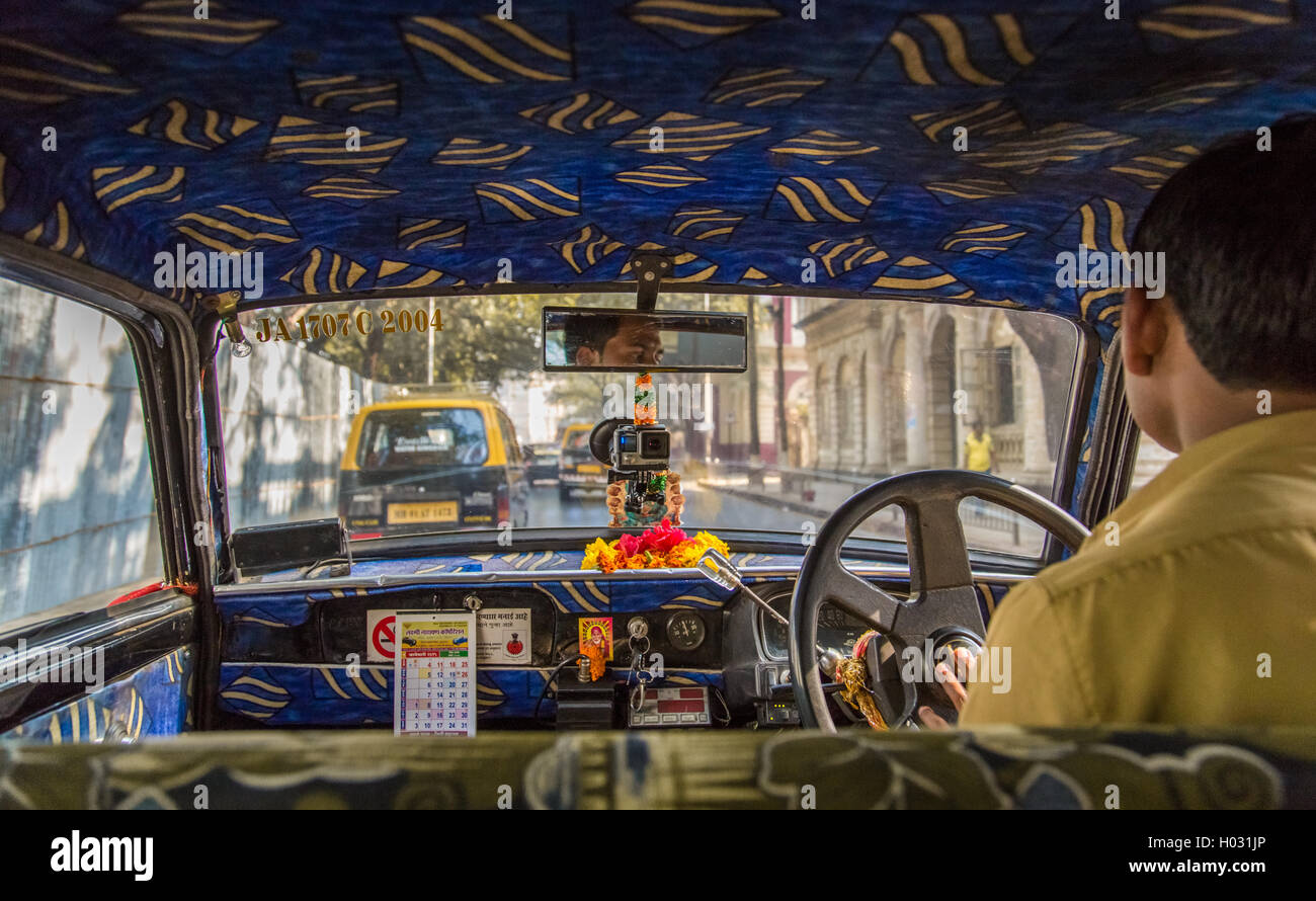 MUMBAI, INDIA - 17 JANUARY 2015: Old taxi's upholstery in Mumbai are decorated Indian style. Stock Photo