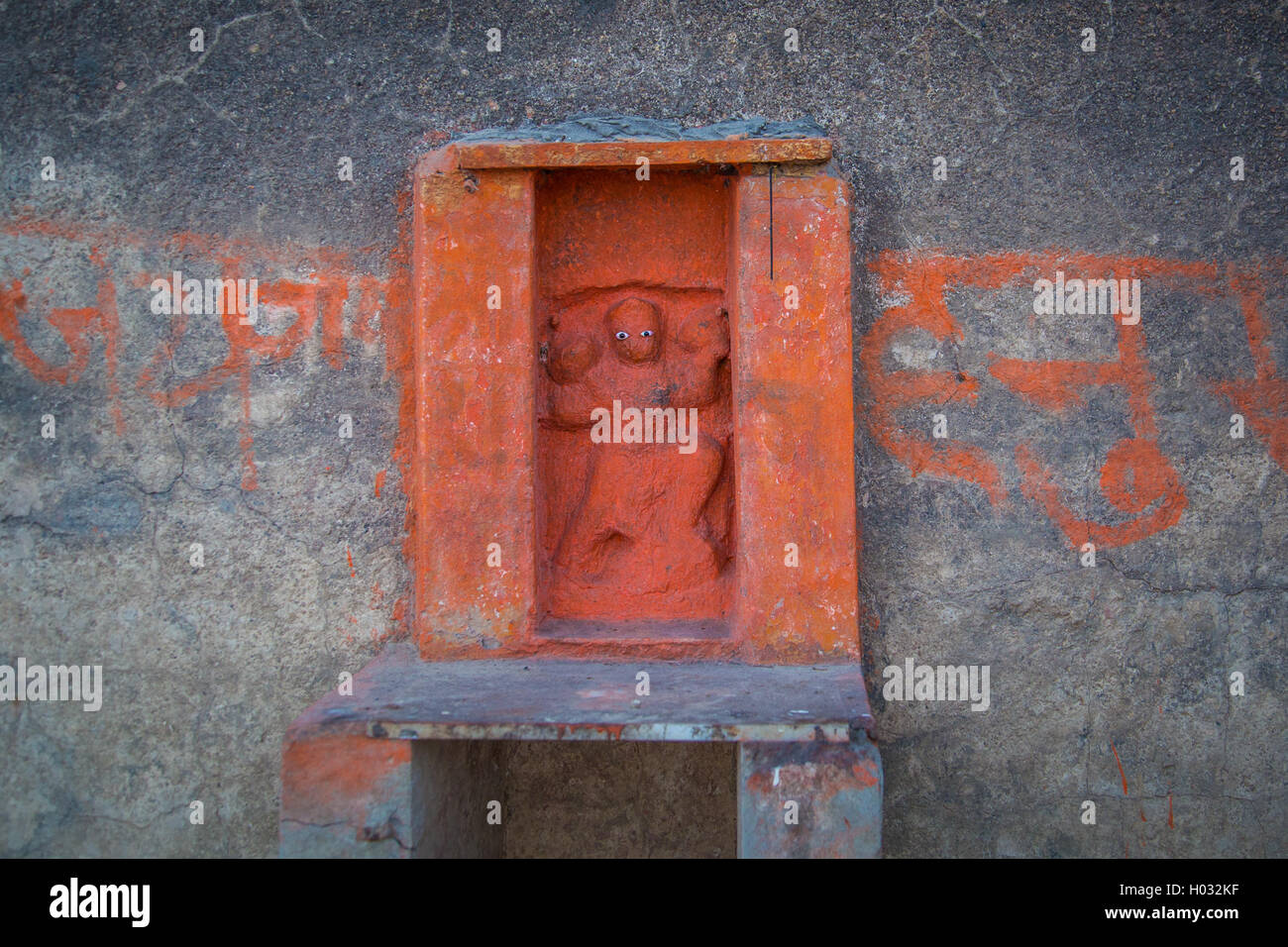 Mini Hindi religious wall sculpture. One of many on India's streets. Stock Photo