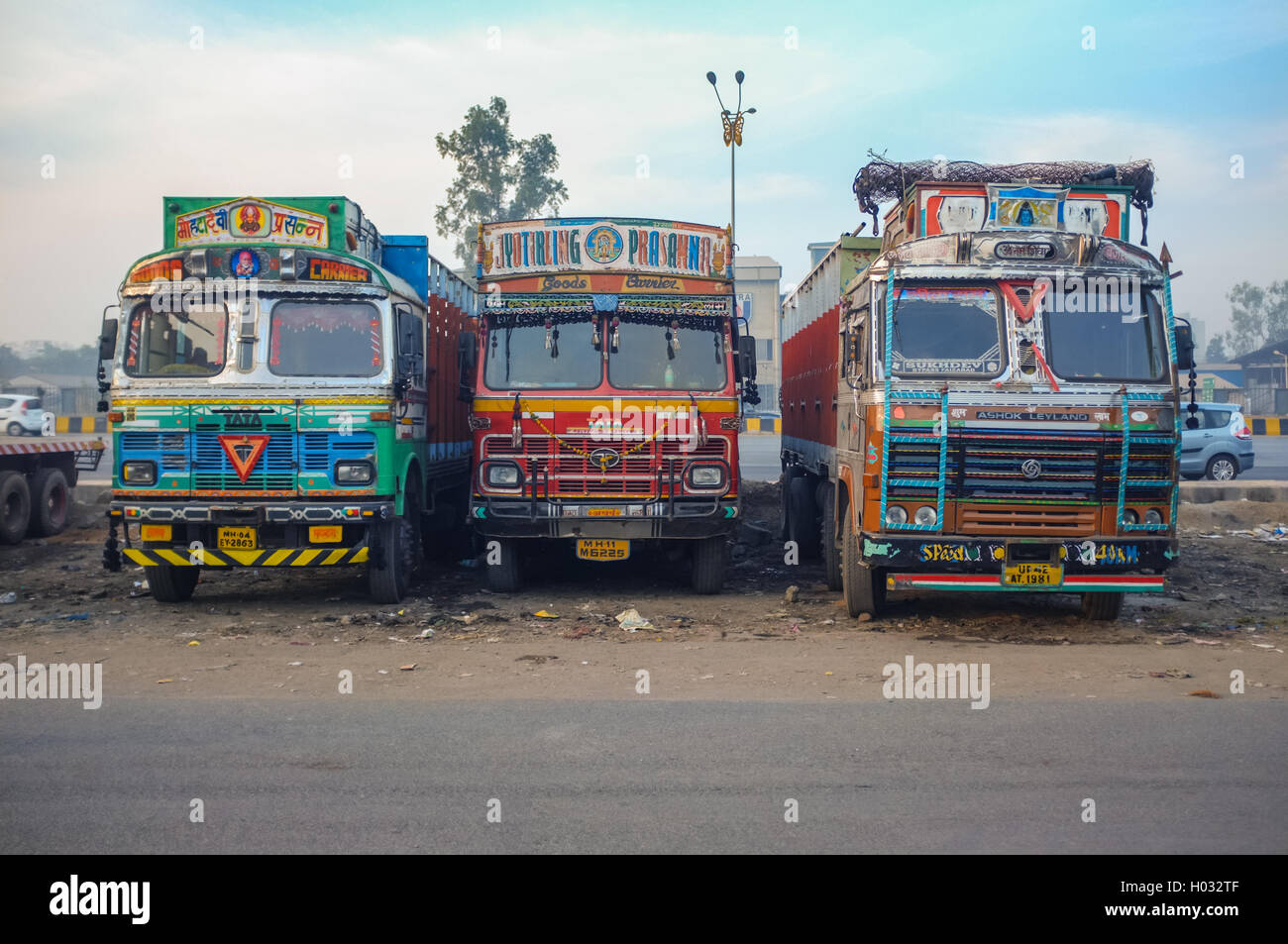 MUMBAI, INDIA - 05 FEBRUARY 2015: Parked trucks on highway rest area decorated in traditional Indian style. Stock Photo