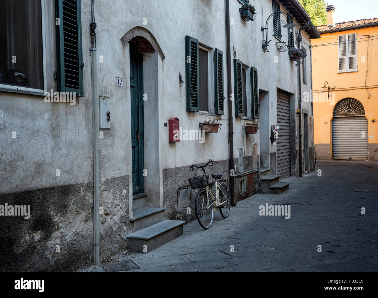 Bicycle in an old residential area of the city of Lucca, Tuscany, Italy Stock Photo