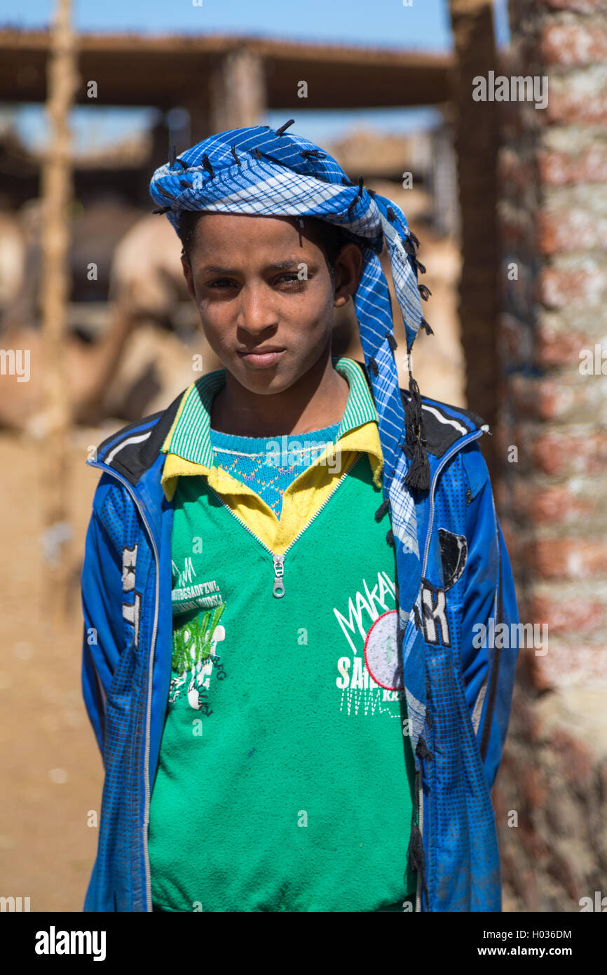 DARAW, EGYPT - FEBRUARY 6, 2016: Portrait of local boy with turban at Camel market. Stock Photo