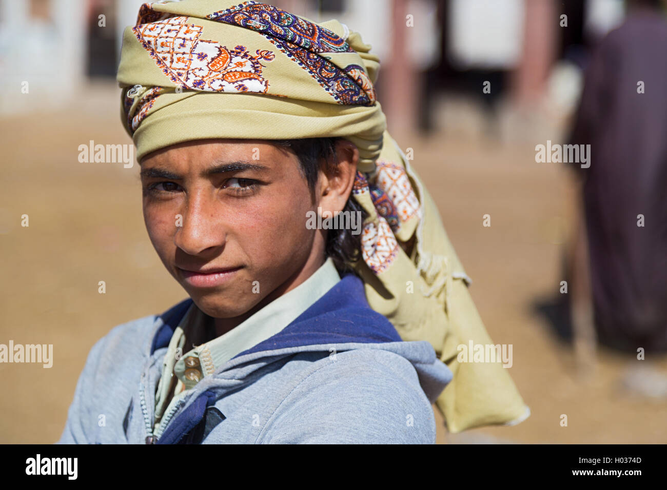 DARAW, EGYPT - FEBRUARY 6, 2016: Portrait of local boy with head scarf. Stock Photo