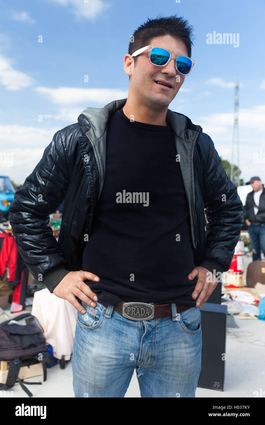 ZAGREB, CROATIA - OCTOBER 20, 2013: Roma salesman posing for camera at Zagreb's flea market Hrelic. Stock Photo