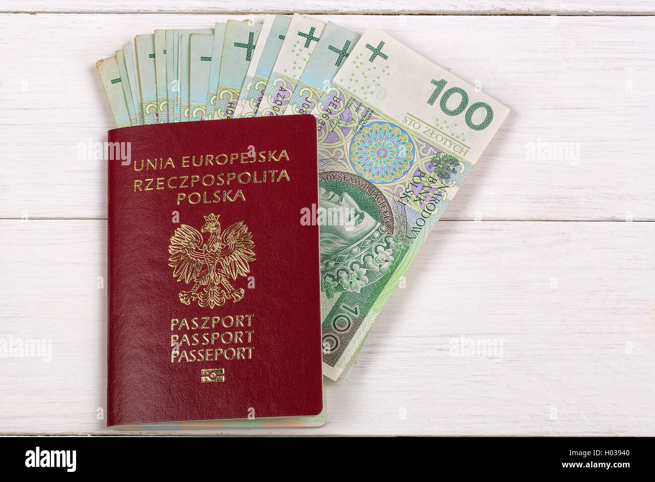 Polish passport with Polish currency Stock Photo