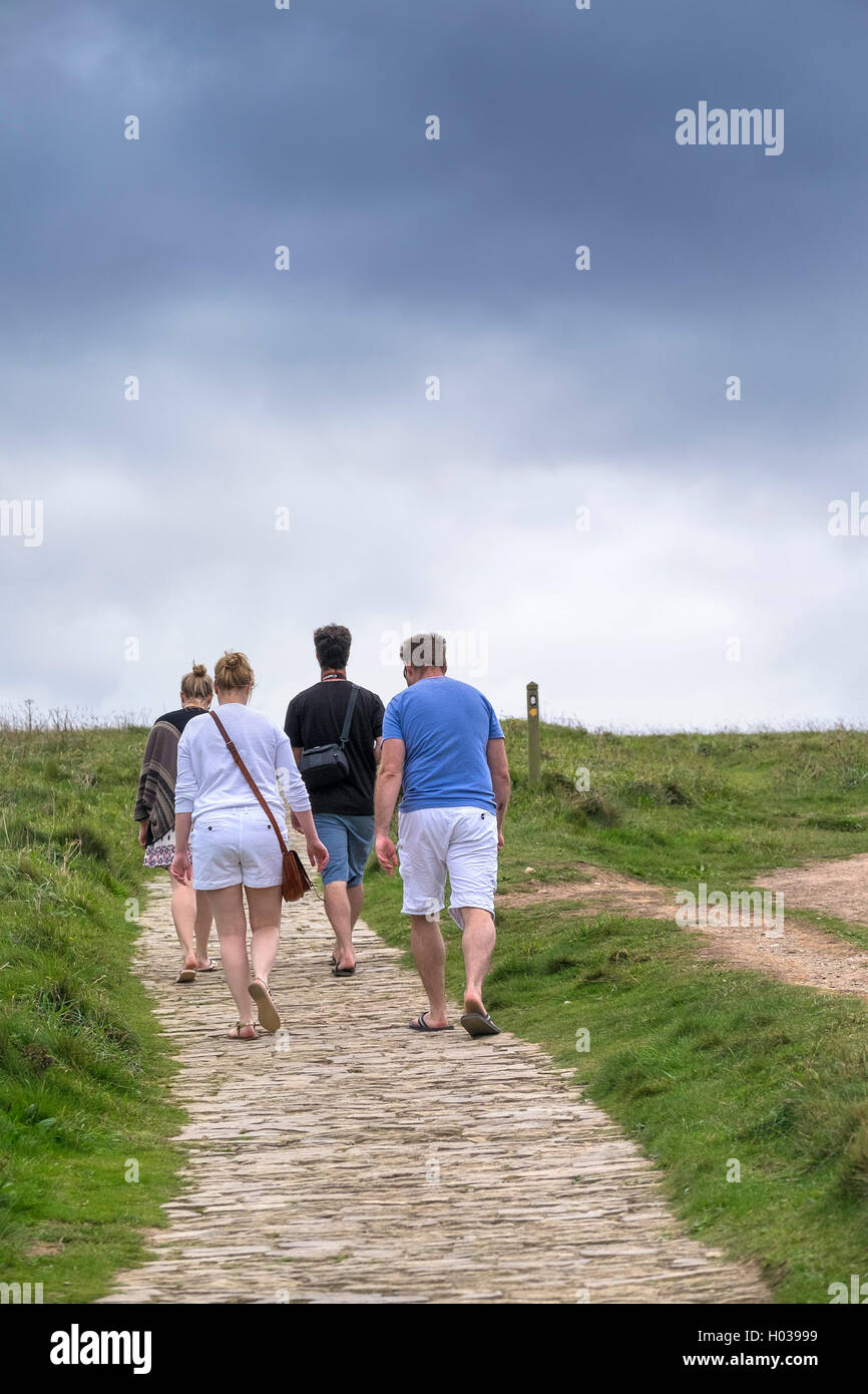 Walkers on the South West Coastal Path in Cornwall. Stock Photo