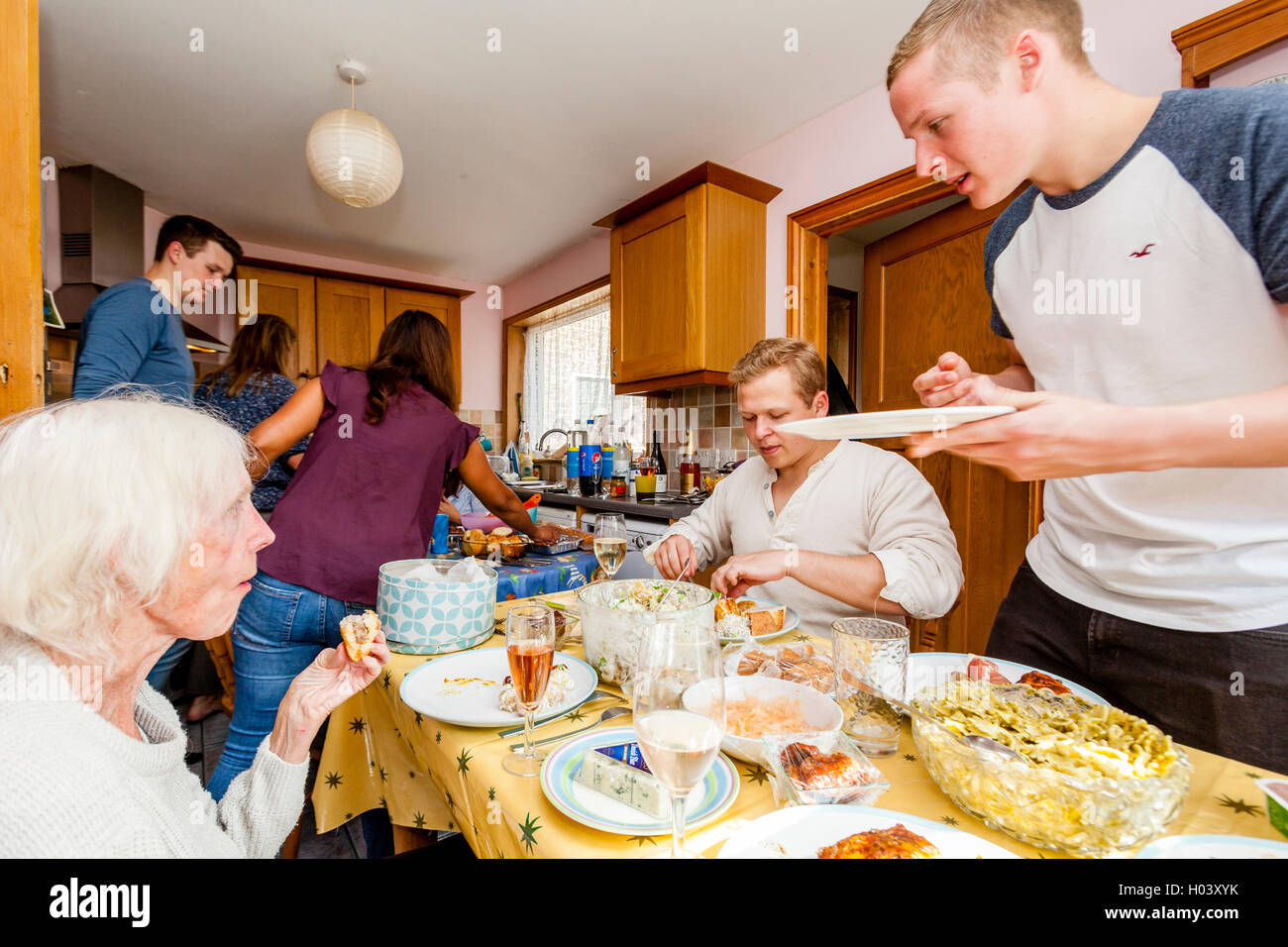A Family Sit Down To A Buffet Meal, Sussex, UK Stock Photo Alamy