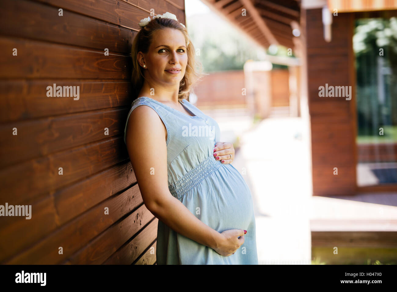 Beautiful pregnant woman holding her belly Stock Photo - Alamy