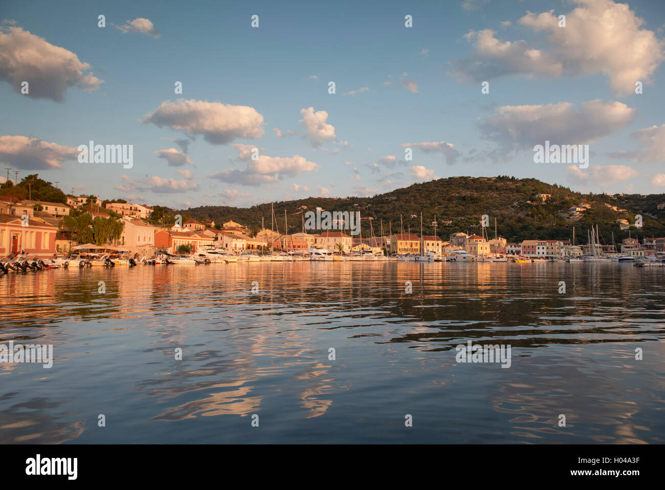 The picturesque harbour of Gaios at sunrise on Paxos, The Ionian Islands, The Greek Islands, Greece, Europe Stock Photo