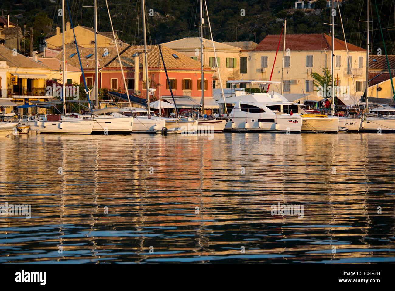 The picturesque harbour of Gaios at sunrise on Paxos, The Ionian Islands, The Greek Islands, Greece, Europe Stock Photo