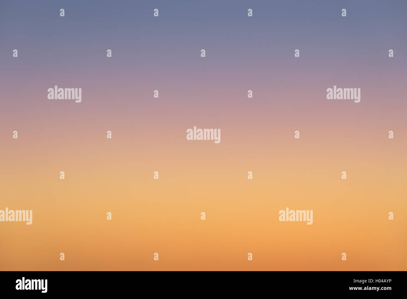 photo of orange and blue sunset sky gradient background Stock Photo