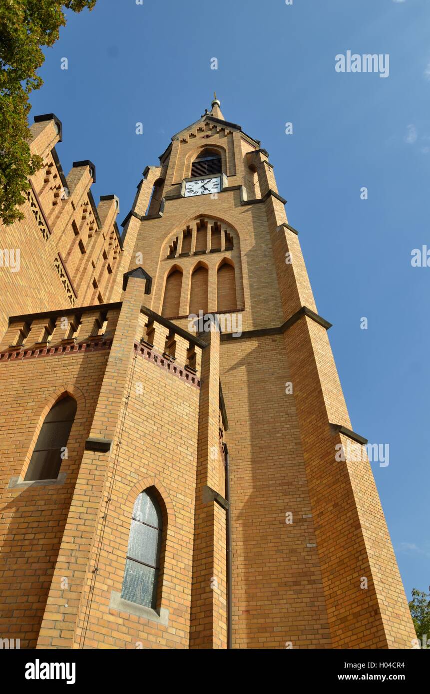 Church tower out of yellow brick Stock Photo