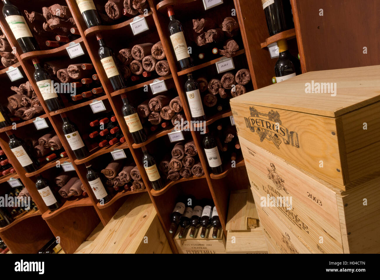 Bordeaux wines fine luxury wine bottles and cases on display at 'Bordeaux Classique' wine shop in Saint Emilion Bordeaux France Stock Photo