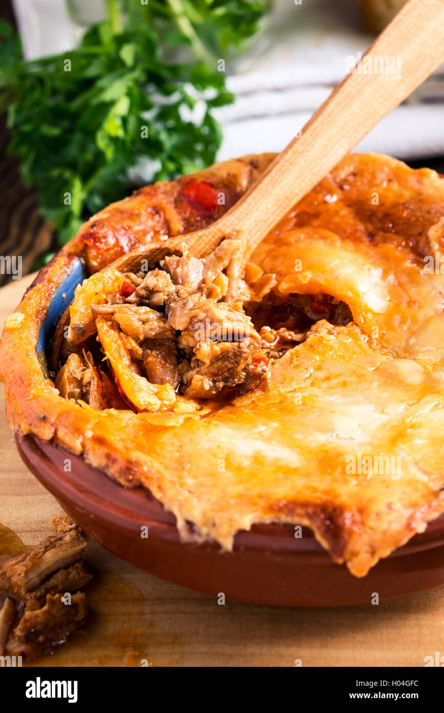 Juicy meat pot pie in a ceramic oven pot, beef stew pie with puff