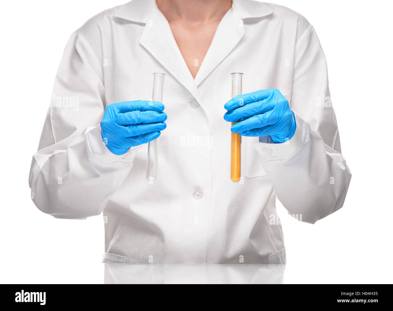 Close up of female in white gown and blue gloves holding empty transparent white glass test tube and with yellow sorbent Stock Photo