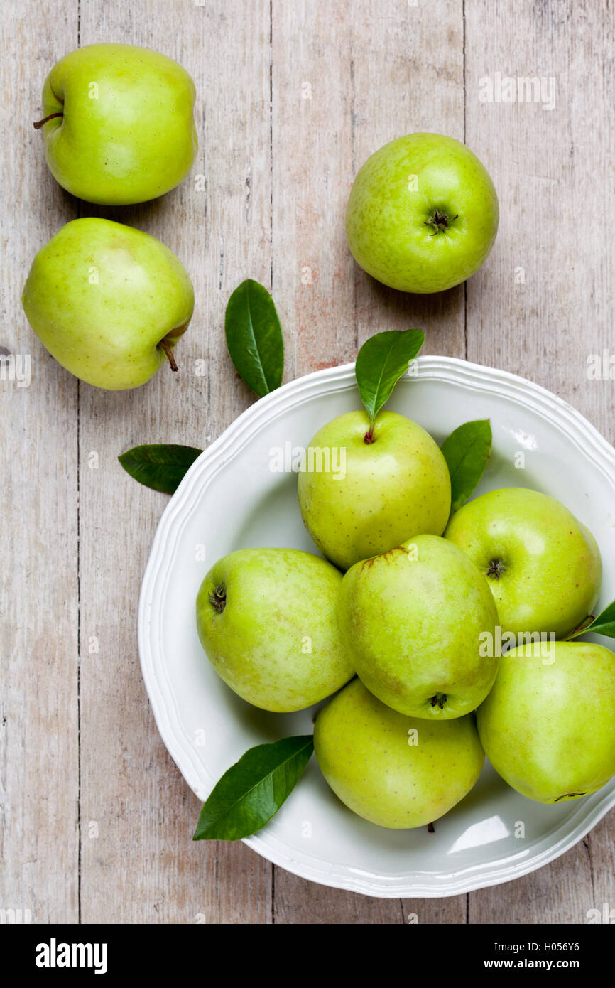 fresh green apples in plate Stock Photo