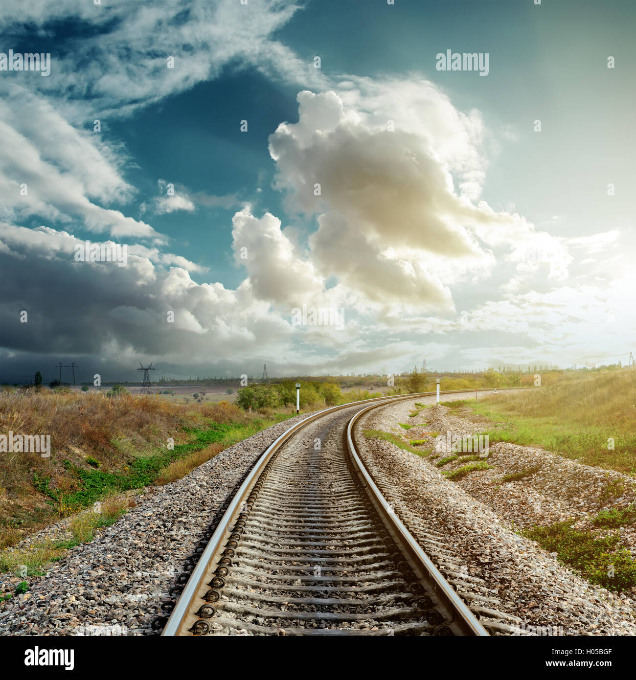 railroad goes to cloudy horizon Stock Photo