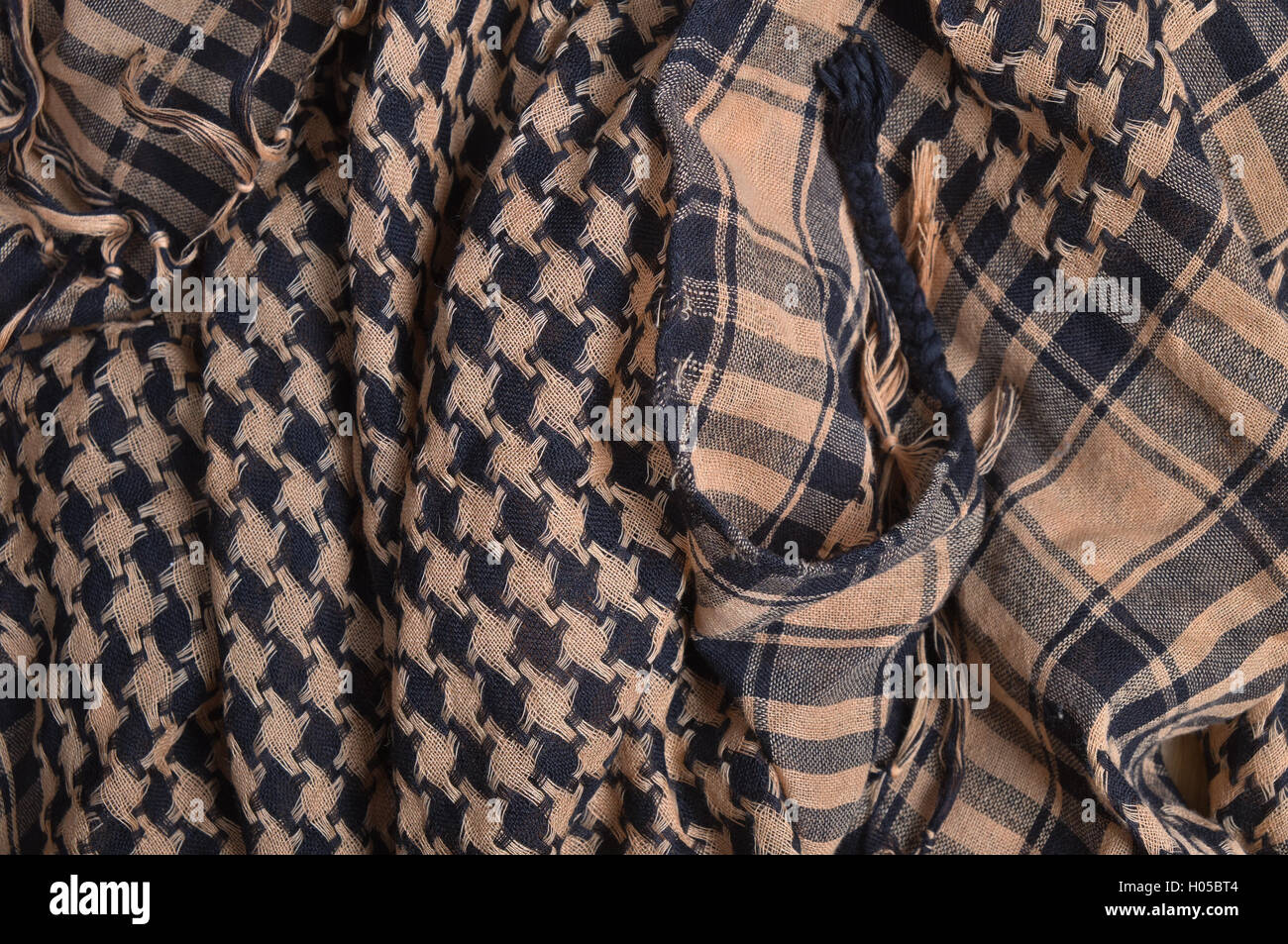 Shemagh (Keffiyeh) scarf. Traditional and tactical garments Stock Photo