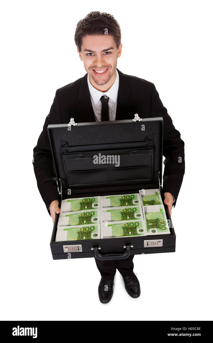 Businessman with suitcase full of cash Stock Photo Alamy