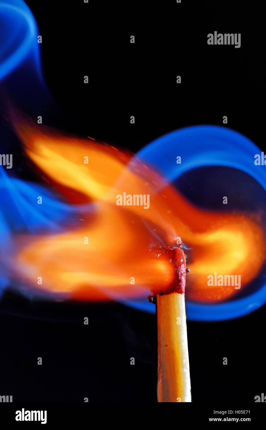 lighting a match on black background Stock Photo Alamy