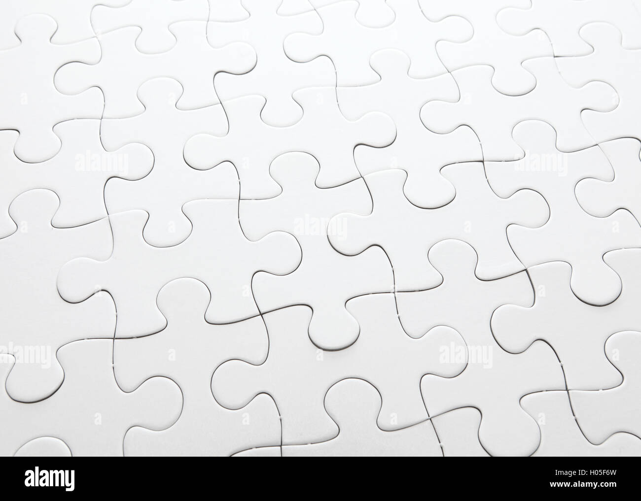 Complete white jigsaw puzzle Stock Photo Alamy