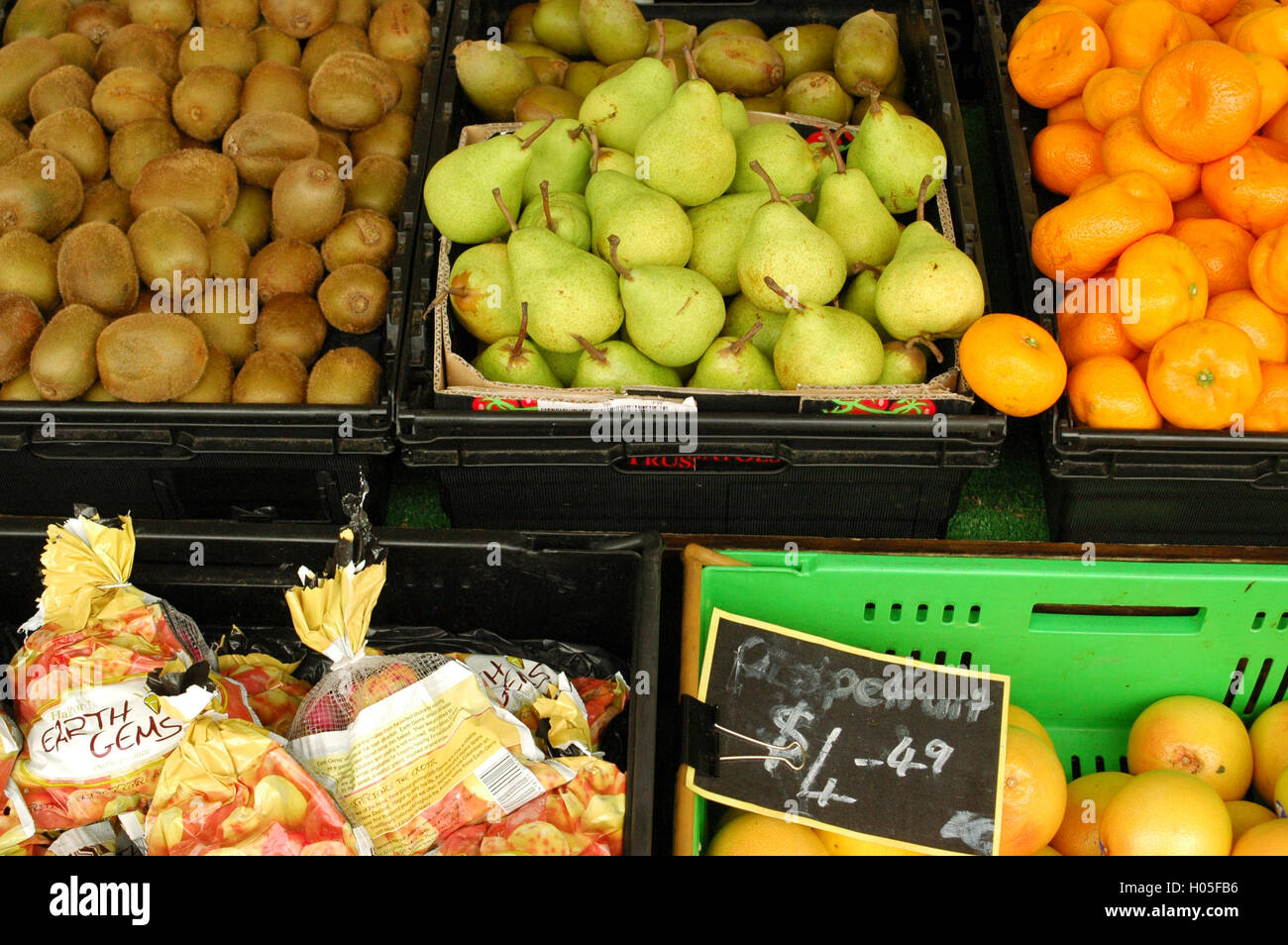 Various fruits in plastic crates Stock Photo Alamy