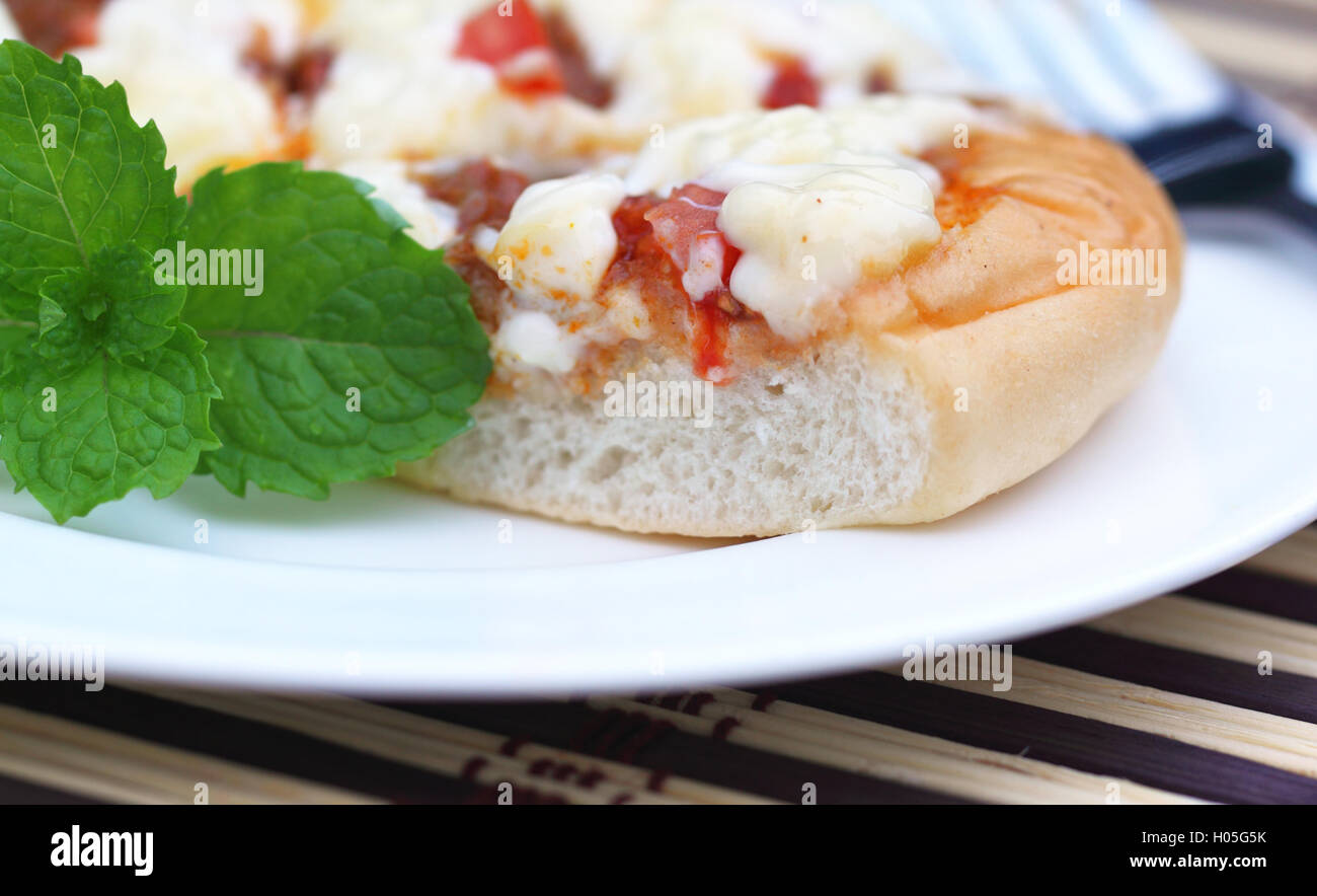 Pizza with mint leaves Stock Photo Alamy