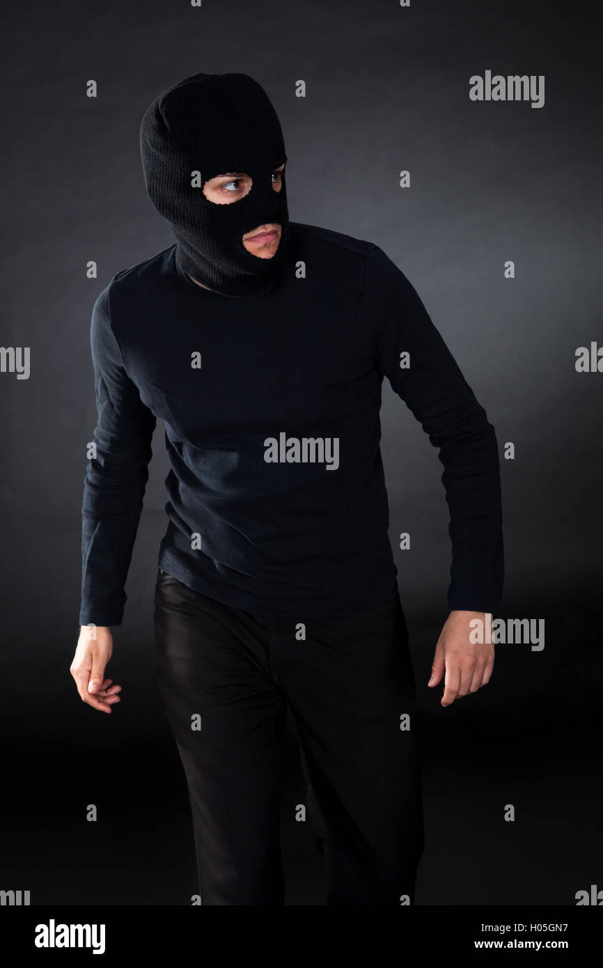 Thief wearing a balaclava Stock Photo Alamy