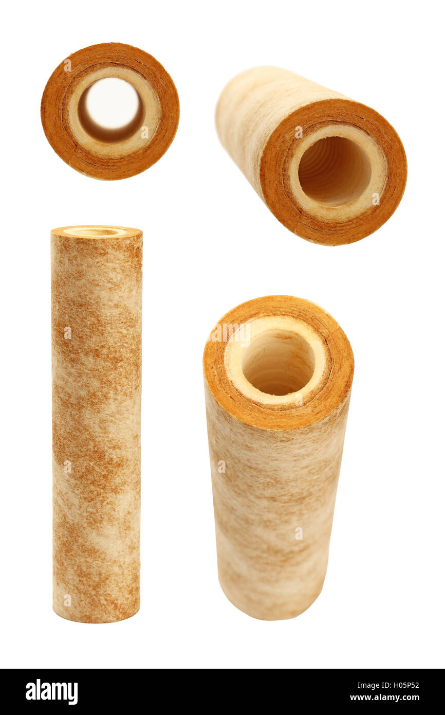 Used dirty rusty brown home sediment drinking water filter cartridge replacement for filtration and purification at pre-filter s Stock Photo