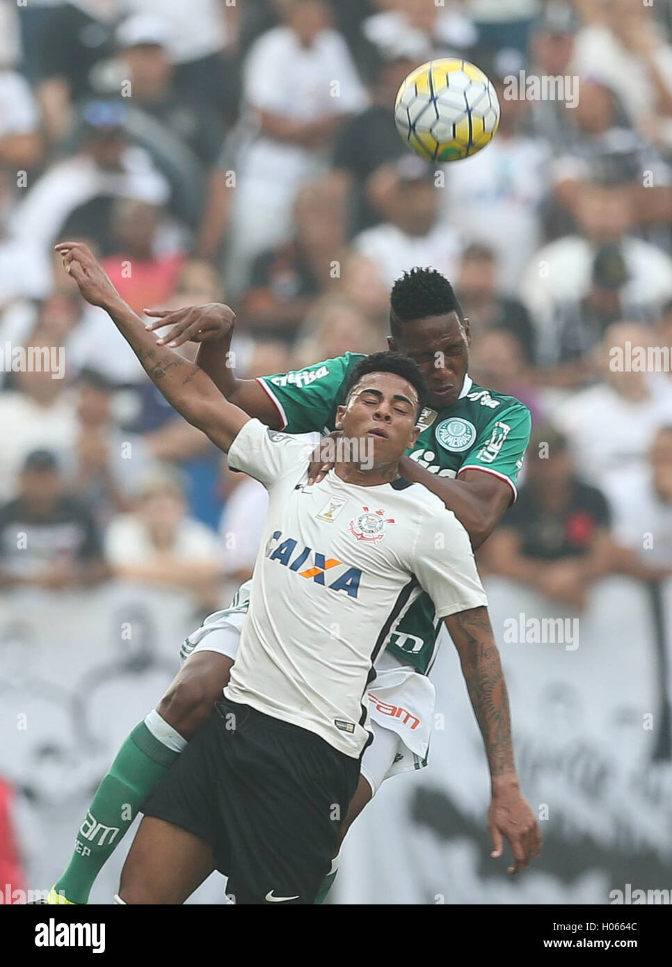 SÃO PAULO, SP - 17.09.2016: CORINTHIANS X PALMEIRAS - The player Mine, SE Palmeiras, ball dispute with Gustavo, SC Corinthians P during match valid for the twenty-sixth round of the Brazilian Championship Serie A at the Arena Corinthians. (Photo: Cesar Greco/Fotoarena) Stock Photo