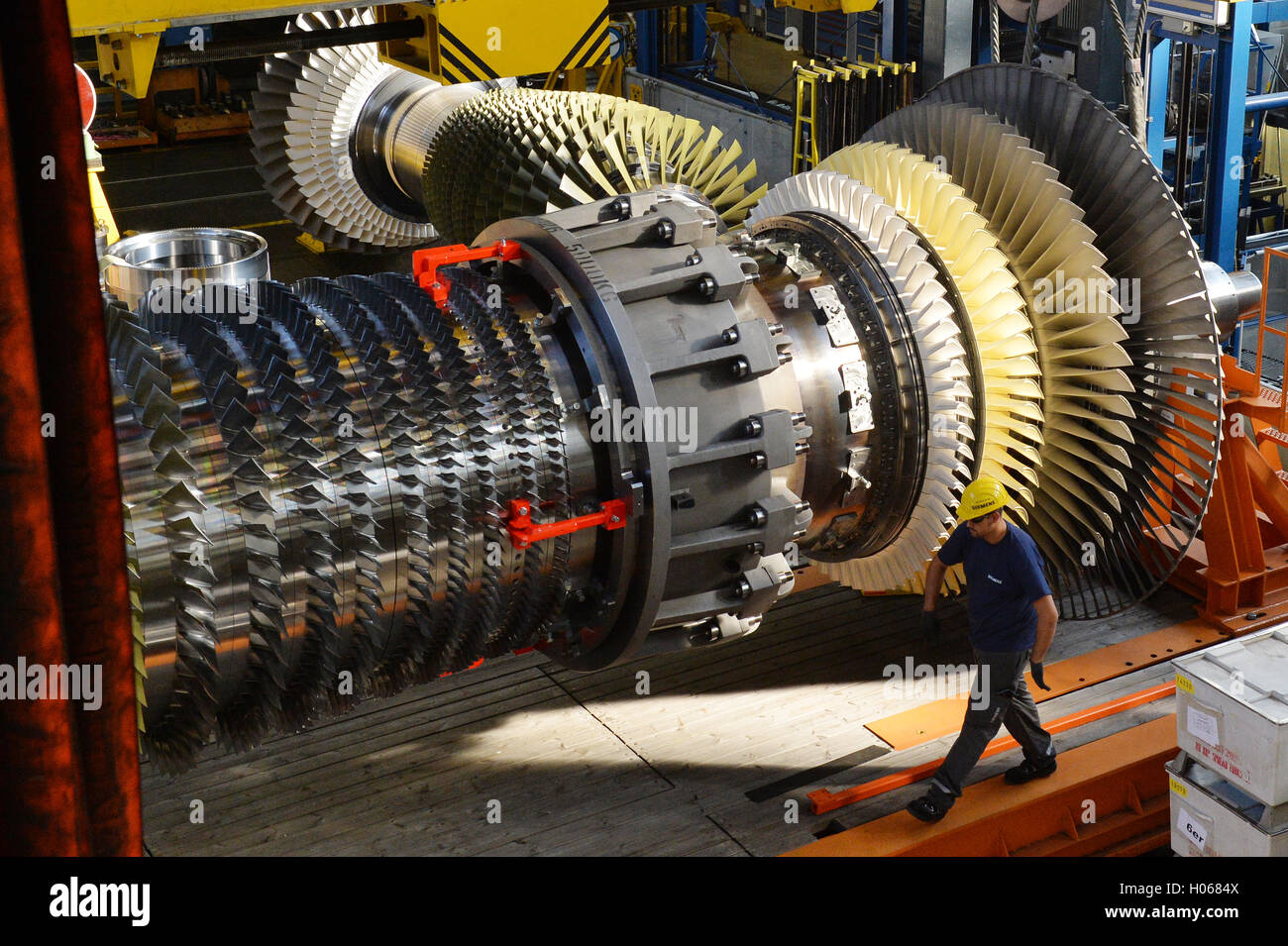Siemens workers monitor a turbine rotor in a gas turbine in Berlin
