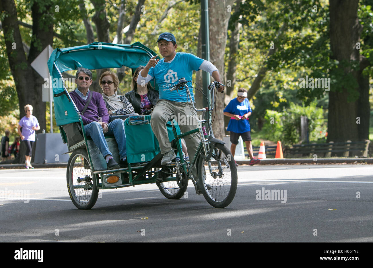 A rickshaw is showing tourists around Central Park. Stock Photo