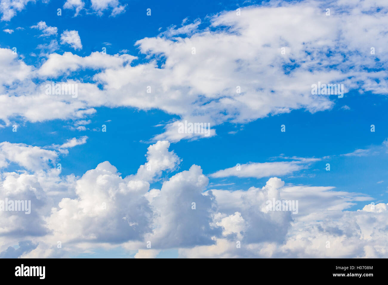 white clouds on bright blue sky Stock Photo - Alamy