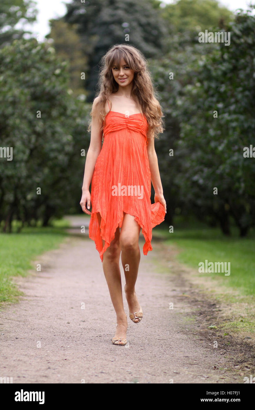 Attractive young woman in red dress Stock Photo