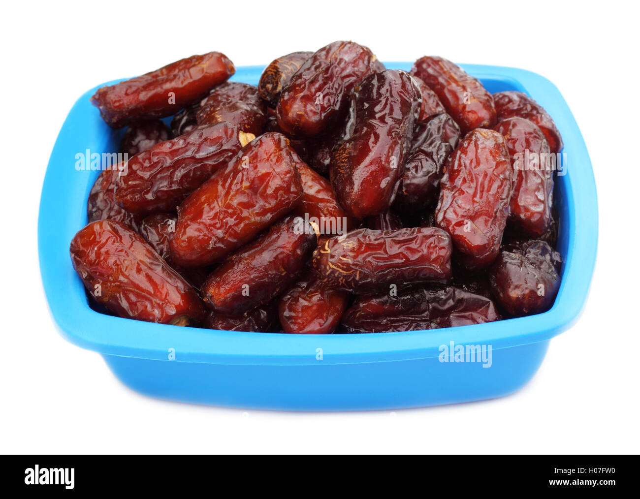 Fresh Arabian Dates on a blue bowl Stock Photo